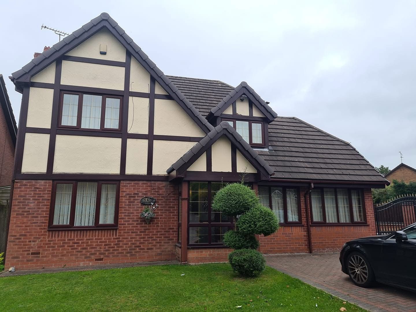 Traditional timbered property fitted with new dark-framed uPVC windows throughout