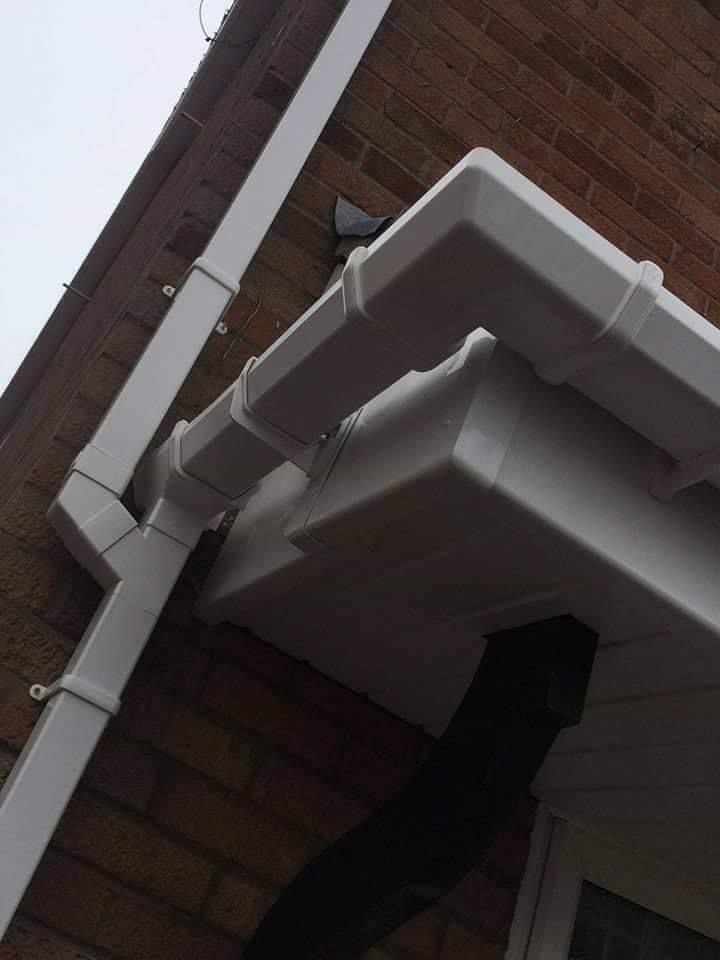 White uPVC guttering and downpipe after replacement