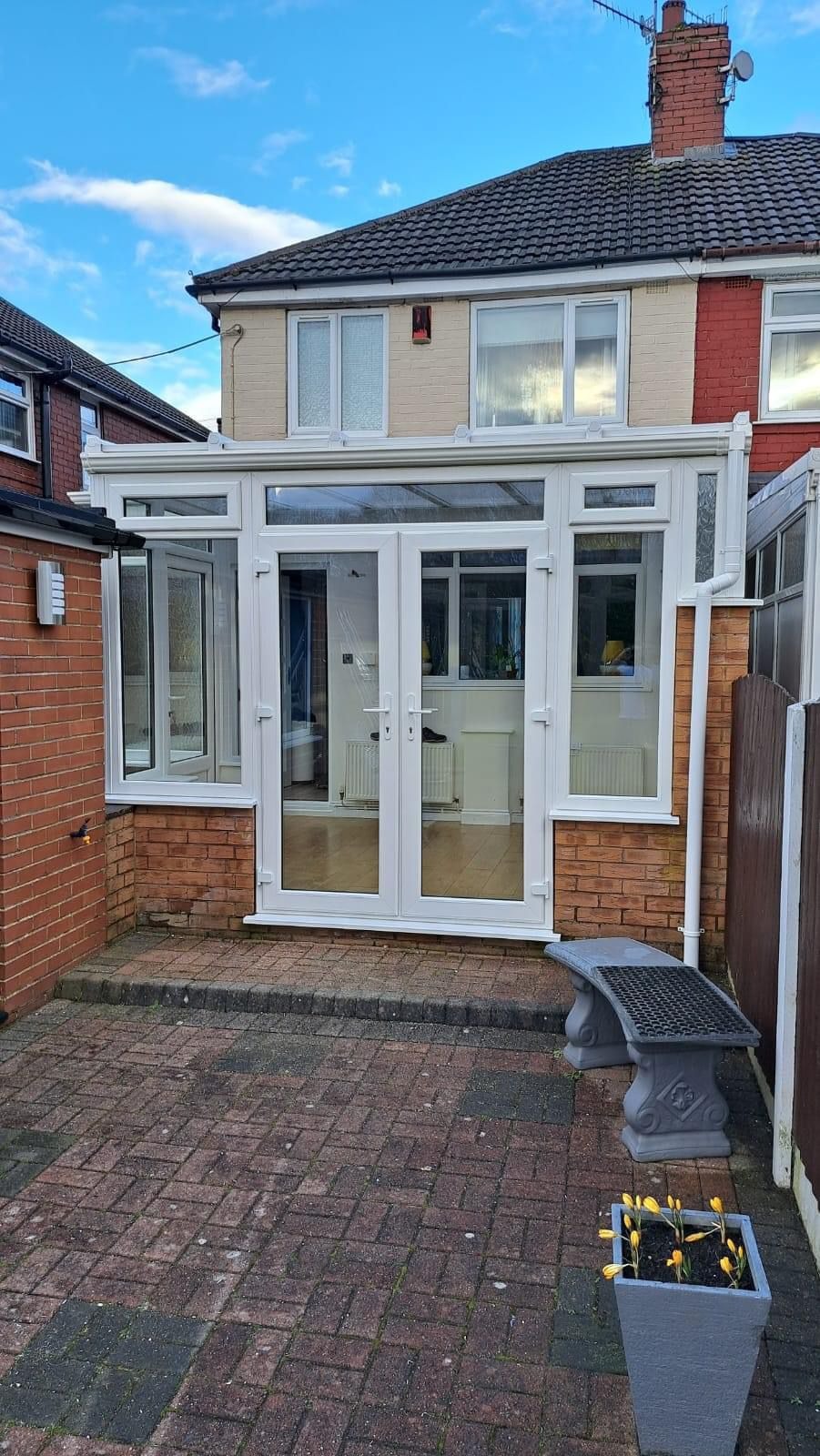 Rear lean-to white uPVC conservatory with French doors fitted in Cheshire