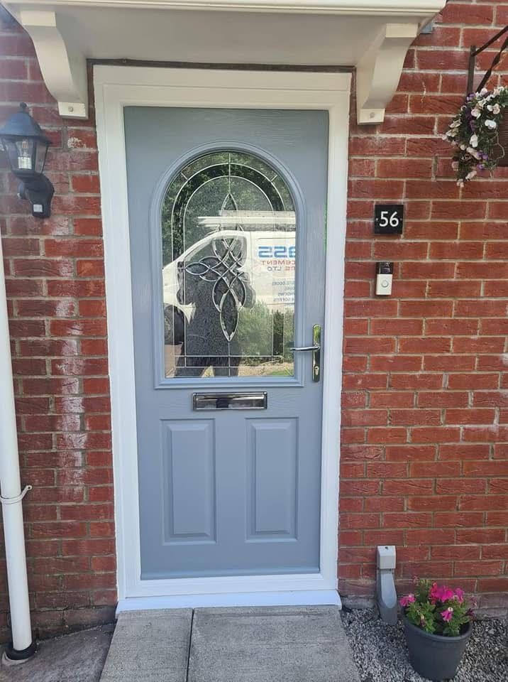 Duck-egg blue composite door with arched leaded glass window fitted in Cheshire